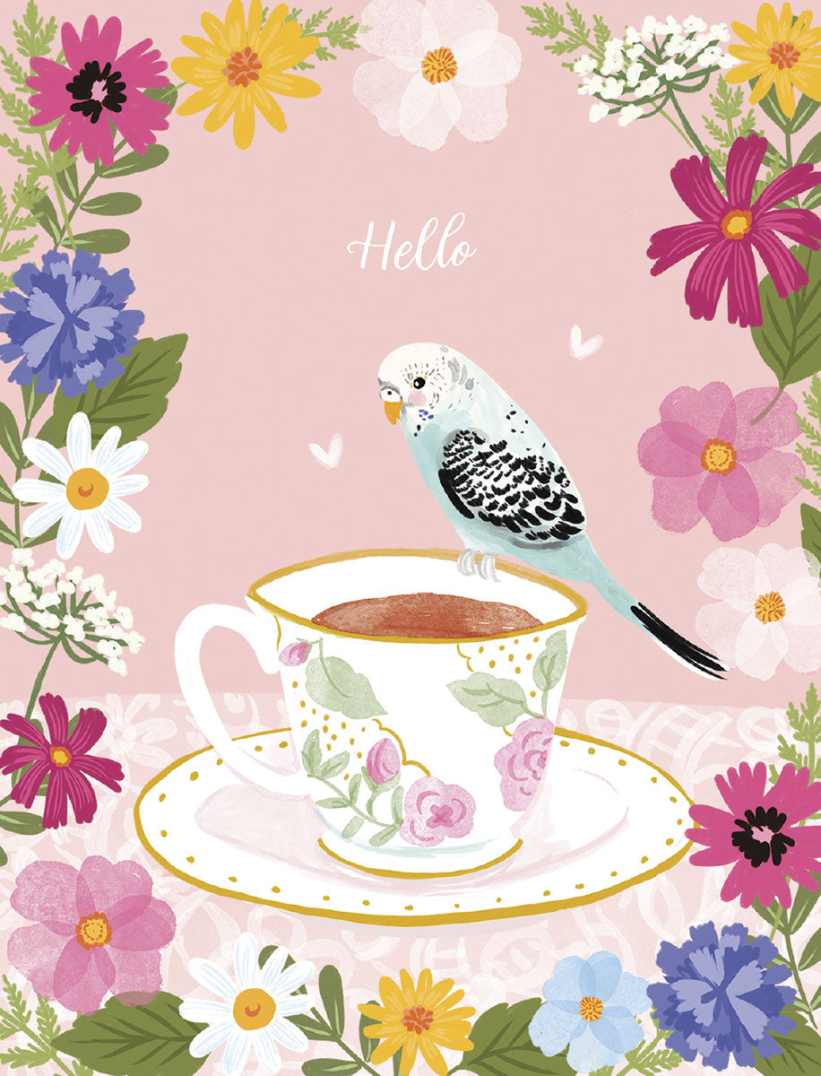 Charming greeting card featuring a blue and white parakeet perched on a vintage teacup, surrounded by a vibrant border of colorful spring flowers on a soft pink background with 'Hello' script.