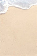 Close-up of a pristine sandy beach with subtle texture and soft ocean waves, representing a serene backdrop for heartfelt messages.