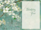 Open view of a comforting greeting card interior, showing graceful dogwood branches, the message 'Thinking of You', and a touching quote: 'When someone you love becomes a memory, the memory becomes a treasure.'