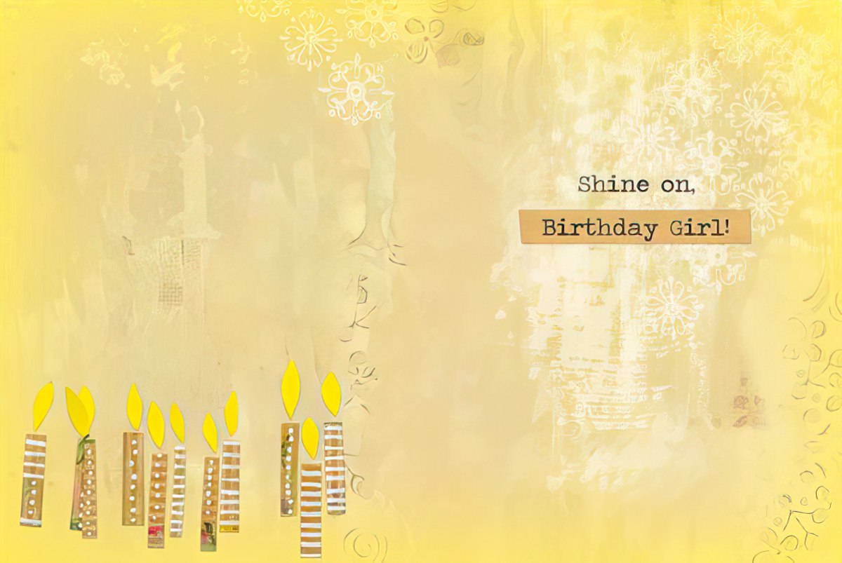 Inside of an artistic yellow birthday card featuring paper candles and the uplifting message: 'Shine on, Birthday Girl!'