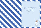 Inside of a lighthearted celebration card, showing blue and white stripes and text 'Just a day spent celebrating however you please! Happy Birthday' with a small coconut drink illustration.