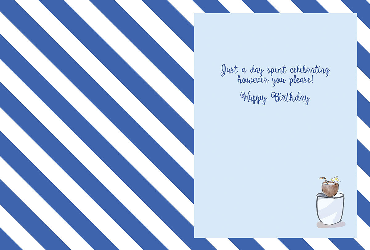 Inside of a lighthearted celebration card, showing blue and white stripes and text 'Just a day spent celebrating however you please! Happy Birthday' with a small coconut drink illustration.
