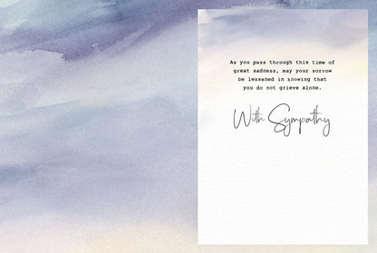 Inside of a sympathy card with a gentle watercolor background and a message of comfort: 'As you pass through this time of great sadness, may your sorrow be lessened in knowing that you do not grieve alone. With Sympathy'.