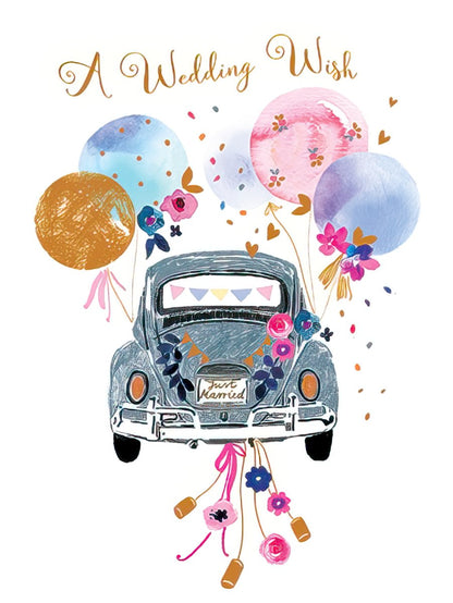 Front of a 'Just Married' wedding card featuring an illustrated vintage bug car, colorful balloons, and floral decorations with gold text.