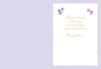 Inside of a lighthearted wedding card with a purple polka-dot background, featuring a heartfelt 'Congratulations!' message in elegant gold script with small floral designs.