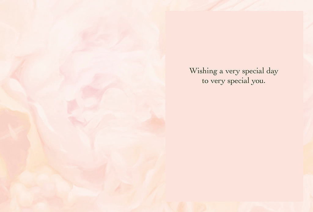 Inside view of a heartfelt greeting card with a soft pink floral background, displaying the warm message 'Wishing a very special day to very special you.'