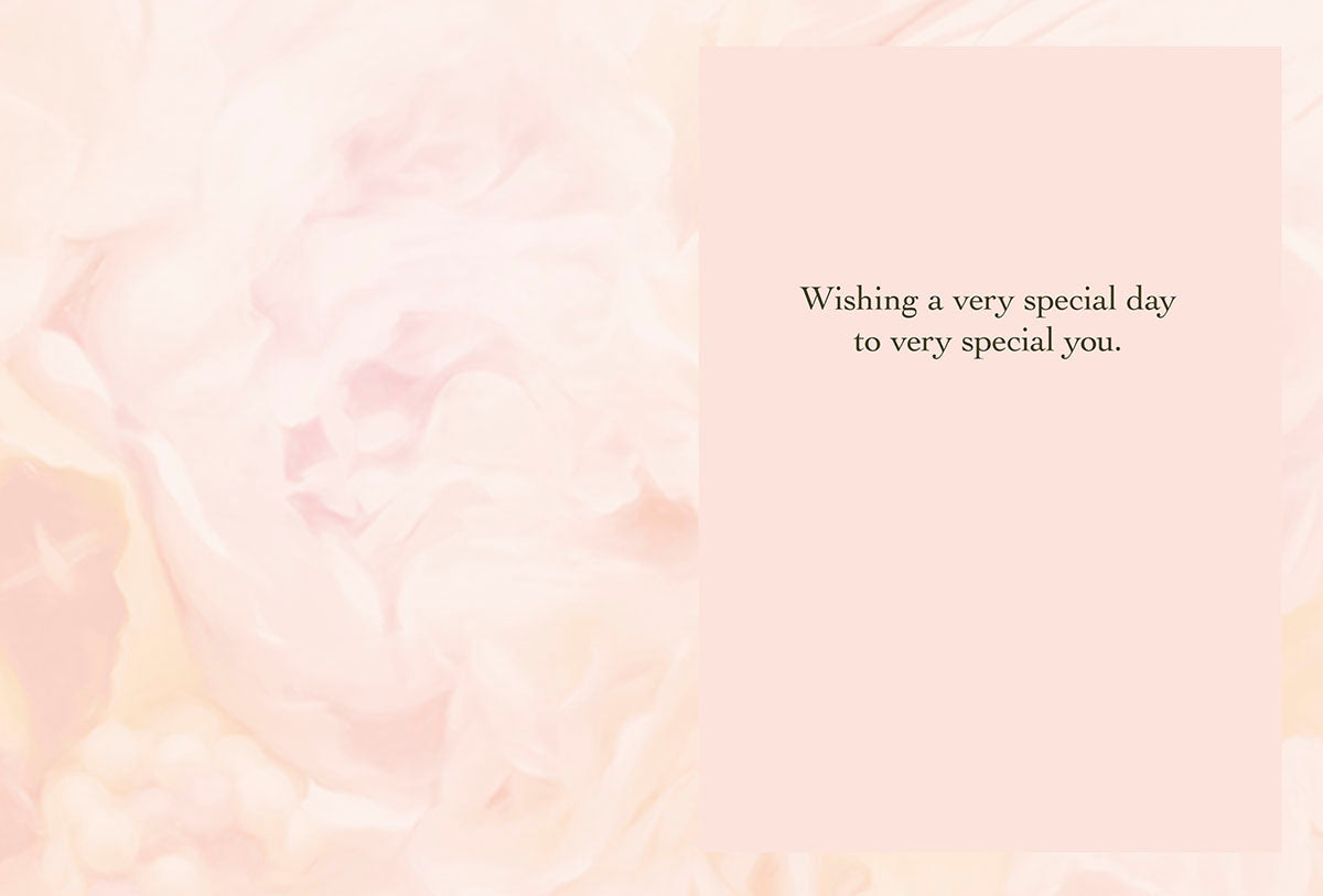 Inside view of a heartfelt greeting card with a soft pink floral background, displaying the warm message 'Wishing a very special day to very special you.'