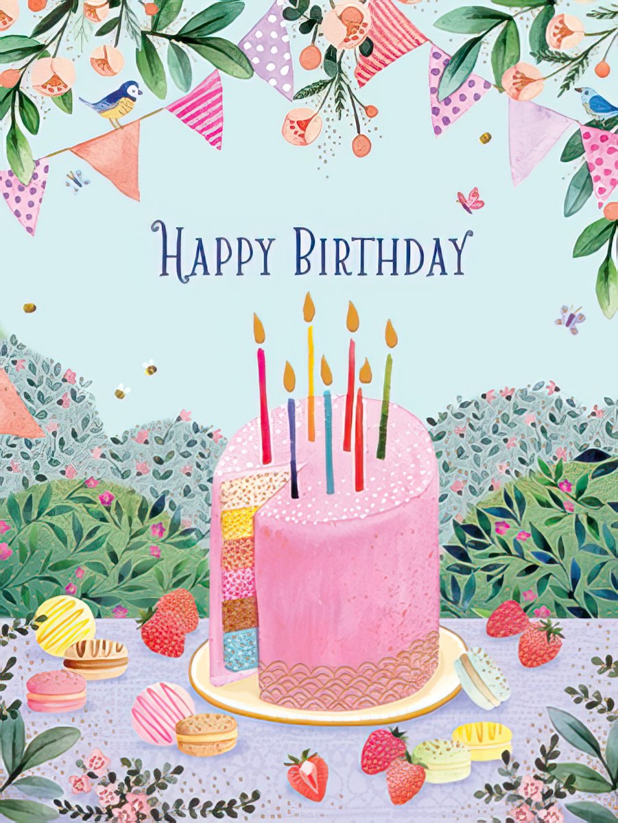 Front of a vibrant, whimsical greeting card featuring a multi-layered pink birthday cake with colorful candles, surrounded by strawberries, macarons, and decorative bunting. Small birds and butterflies flutter around, all against a pastel blue sky with green floral ground. The text 'Happy Birthday' is prominently displayed above the cake.