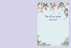 Inside of the whimsical birthday greeting card for children. The light blue background continues, framed by delicate floral and bunting details in the corners. The message 'May all your wishes come true!' is printed on the right side, with ample blank space below for a personalized, heartfelt message.