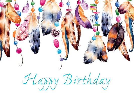 Front of a 'Happy Birthday' greeting card with vibrant watercolor feathers and colorful beaded strings against a white background.