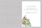 Open greeting card interior featuring a blank grey and white gingham pattern on the left. The right side displays a heartfelt script message: 'It's not just a birthday... It's a beautiful reminder of how lucky the world is to have you in it. Enjoy Your Special Day.' A small succulent and floral cluster adorns the bottom right corner.