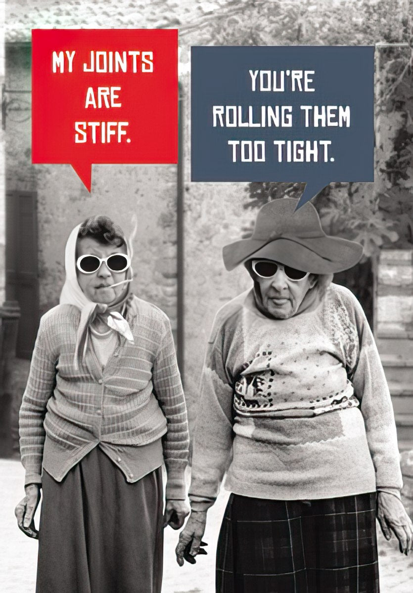 Humorous birthday greeting card featuring two elderly women wearing sunglasses; one says 'MY JOINTS ARE STIFF.' and the other replies 'YOU'RE ROLLING THEM TOO TIGHT.' with a vintage photo style.