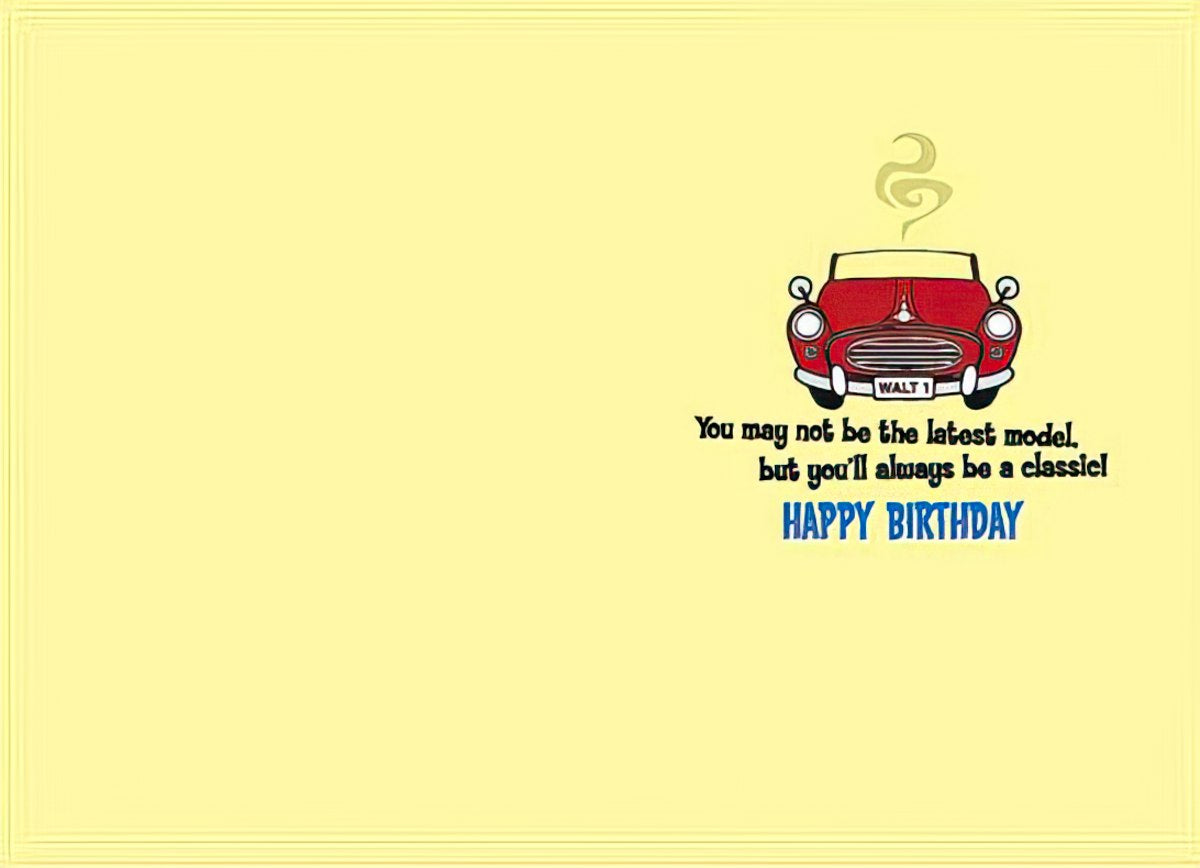 Inside of a funny birthday card for him, showing a small red car and the message 'You may not be the latest model. but you'll always be a classic! HAPPY BIRTHDAY' on a yellow background.