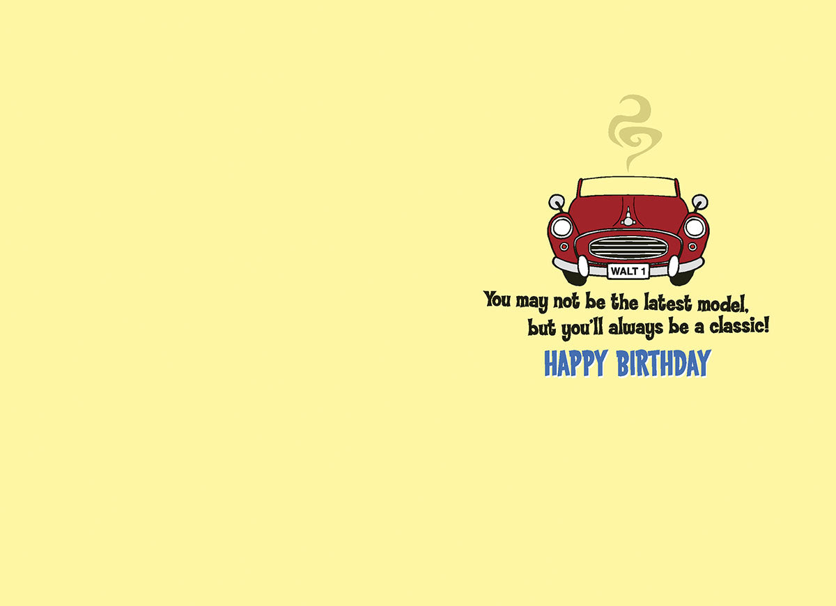 Inside of a funny birthday card displaying a small red classic car and the message: "You may not be the latest model, but you'll always be a classic! HAPPY BIRTHDAY." Perfect for older friends or family.