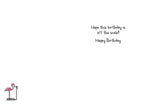 Inside of a funny birthday card, displaying the handwritten message "Hope this birthday is off the scale! Happy Birthday". A small, charming illustration of a pink flamingo standing on a weight scale is visible in the bottom left corner, reinforcing the card's witty theme.