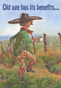 Funny birthday greeting card depicting a cartoon cowboy with a bare bottom, a lasso, and coffee mug, walking past a rustic fence with the humorous text 'Old age has its benefits...'. Perfect for him.