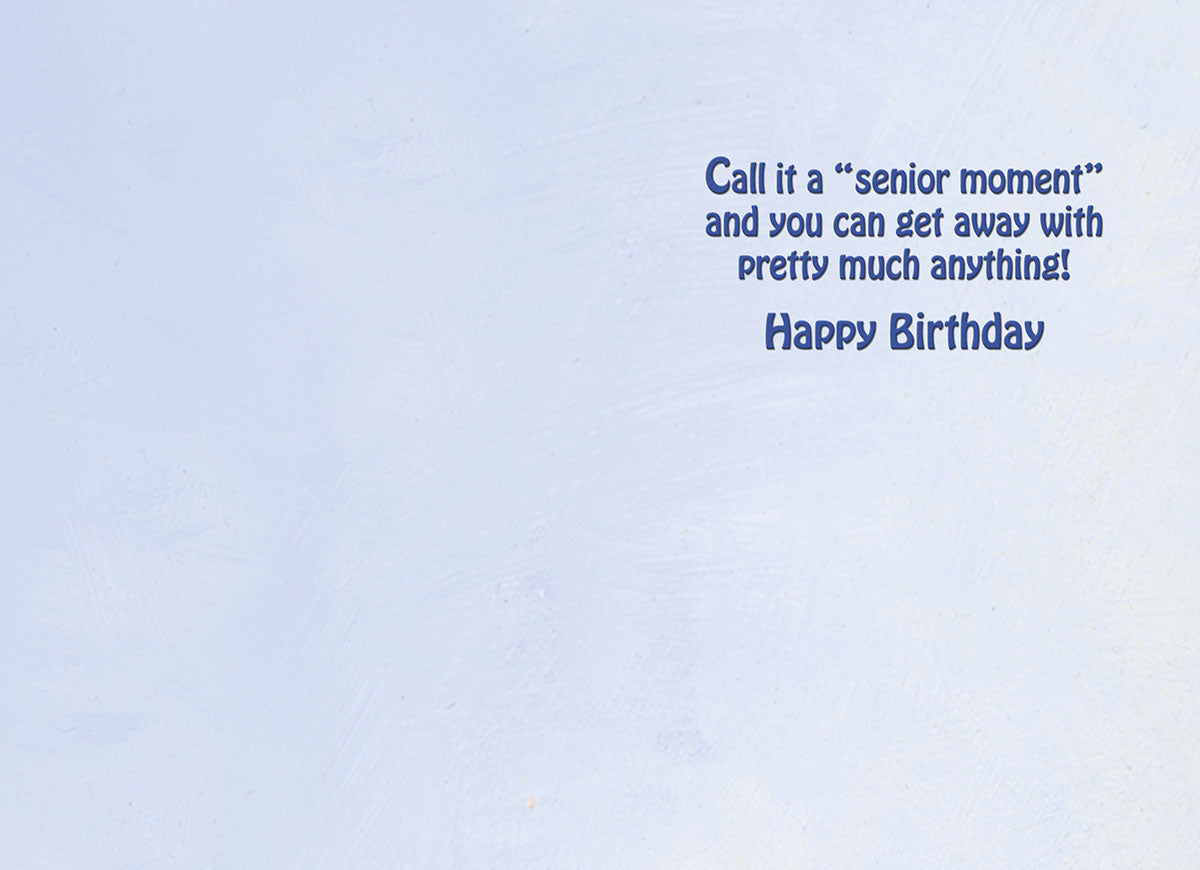 Inside of a humorous birthday card with a light blue background and the witty message 'Call it a “senior moment” and you can get away with pretty much anything! Happy Birthday', ready for a personal touch.