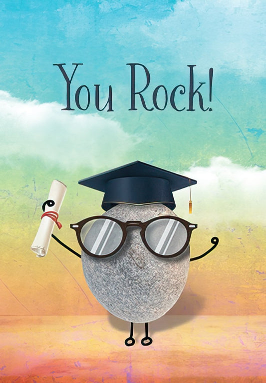 Front of a graduation card featuring a cute rock character with eyeglasses and a graduation cap, holding a diploma, against a blue and orange sky. Text says 'You Rock!'