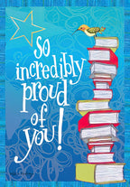 Front of a graduation greeting card featuring a tall stack of academic books, a small hummingbird, and a shimmering gold star on a vibrant blue background. Bold white script reads 'So incredibly proud of you!'