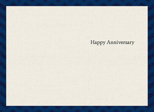Inside a minimalist anniversary greeting card showing the simple, elegant text 'Happy Anniversary' on a light cream background, bordered by a blue chevron pattern.