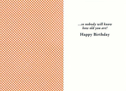 Inside of a funny birthday card with an orange pattern and text: '...so nobody will know how old you are! Happy Birthday'