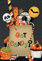 Front of a Halloween greeting card featuring a brown paper bag filled with a vibrant assortment of spooky sweet treats like skull lollipops, candy corn, cupcakes, and caramel apples, with 'Got Candy?' text.