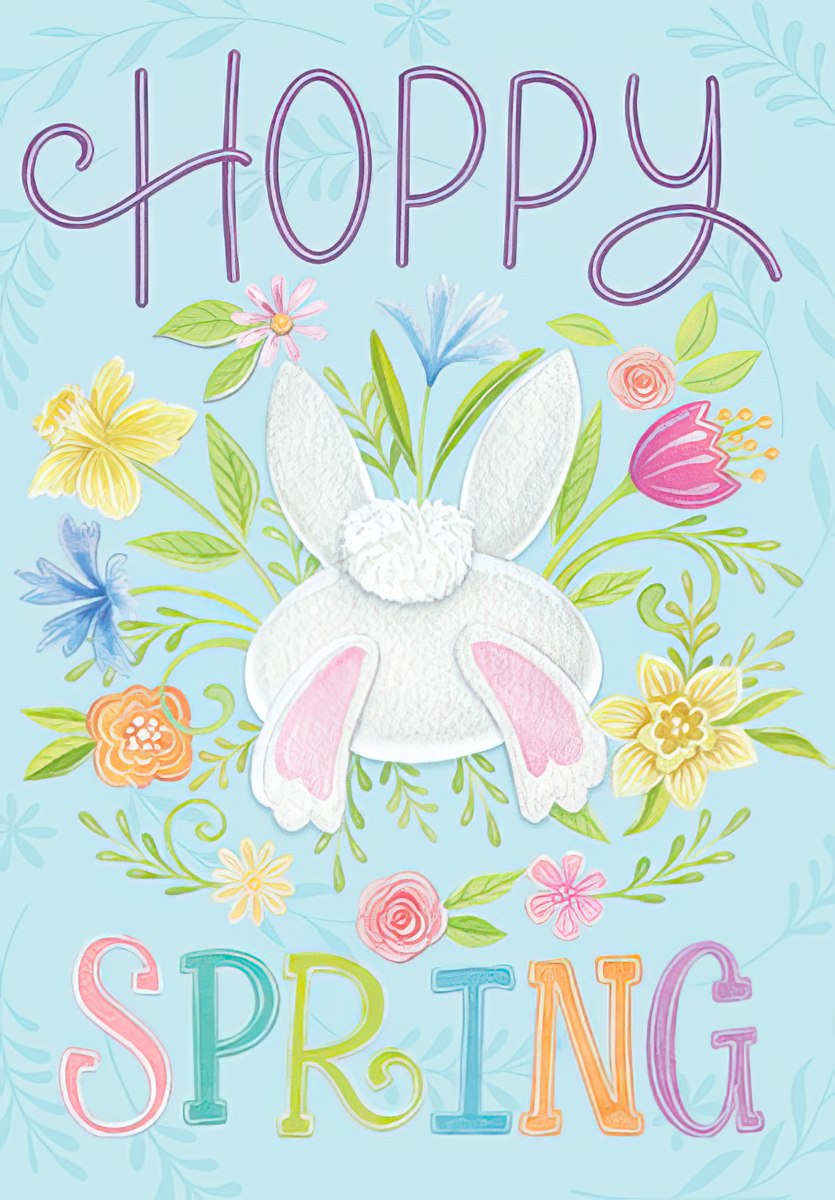Cute Easter card front featuring a fluffy white bunny tail and pink feet emerging from vibrant spring flowers like daffodils, tulips, and cornflowers, with 'HOPPY SPRING' text on a light blue background.