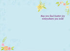 Inside of a light blue Easter greeting card with delicate floral accents in the corners and purple text reading 'May you find Easter joy everywhere you look!'