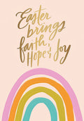 Front view of a peach greeting card with gold foil script 'Easter brings faith, hope & joy' and a vibrant watercolor rainbow graphic.