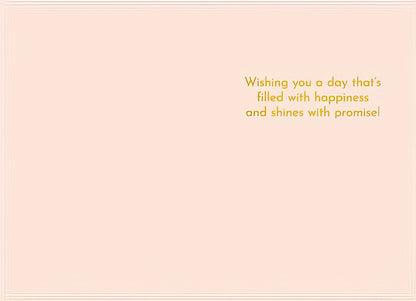 Inside of an Easter card with gold text 'Wishing you a day that's filled with happiness and shines with promise!' on a light pink background.