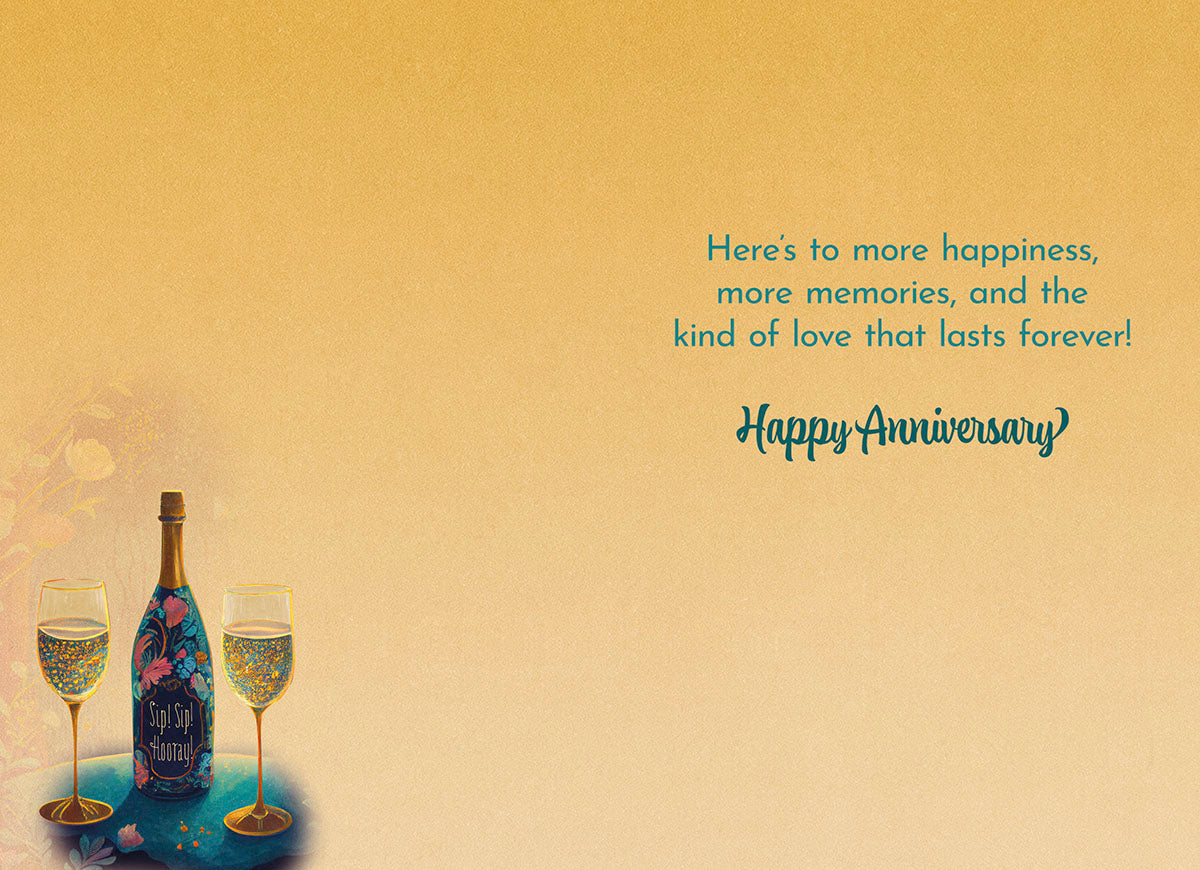Interior of champagne card: 'Here's to more happiness, more memories, and the kind of love that lasts forever! Happy Anniversary'.