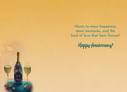 Interior of champagne card: 'Here's to more happiness, more memories, and the kind of love that lasts forever! Happy Anniversary'.