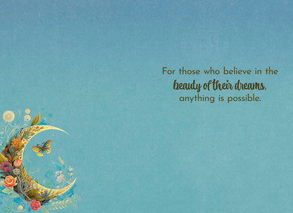 Interior of crescent moon card: 'For those who believe in the beauty of their dreams, anything is possible.' on a light blue background.