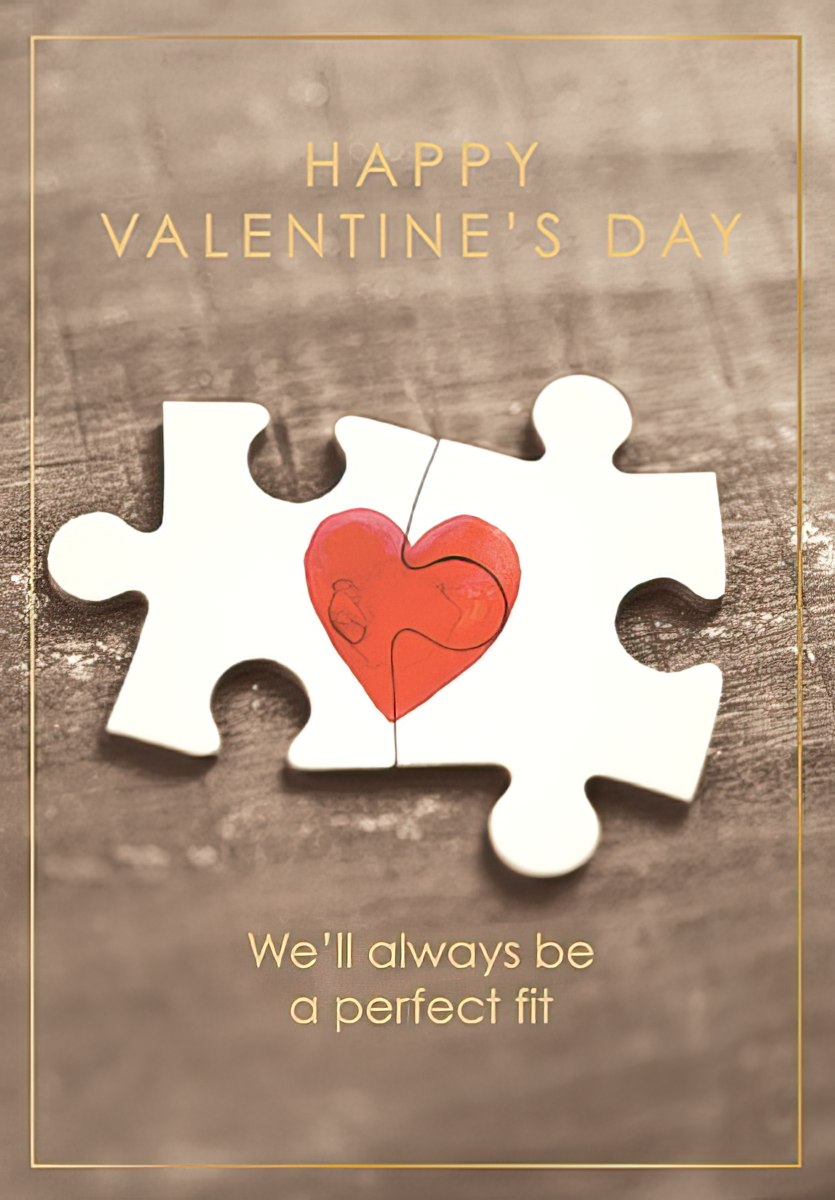Romantic Valentine's Day greeting card featuring two interlocking puzzle pieces forming a vibrant red heart, with the message 'We'll always be a perfect fit' and 'Happy Valentine's Day' text against a rustic wooden background with a gold border. Perfect for a spouse or partner.