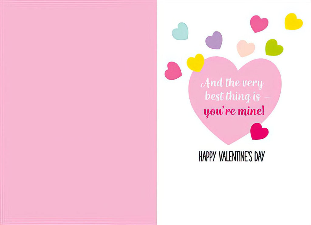 Inside of a romantic Valentine's Day card, displaying a pink heart with the heartfelt message 'And the very best thing is - you're mine!' surrounded by colorful floating hearts, wishing 'HAPPY VALENTINE'S DAY'.
