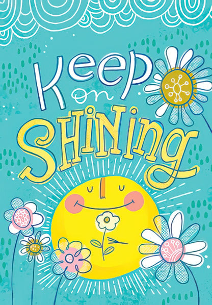 The front of a cheerful card with a smiling sun, flowers, and the message "Keep on Shining" on a bright blue background.