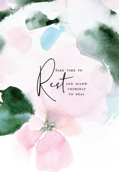 The front of a serene watercolor card with pink, green, and blue hues and the prominent script word "Rest".