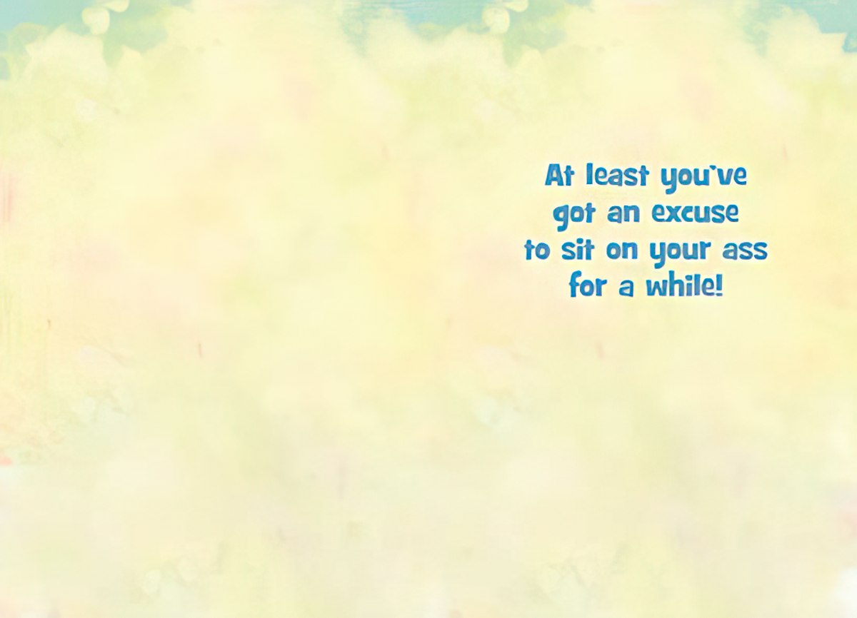 Inside view of a funny get well card with a light yellow background and the text 'At least you've got an excuse to sit on your ass for a while!' in blue lettering, offering a cheeky message for recovery.