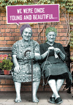 Greeting card featuring two cheerful elderly women on a bench, one knitting, under text 'WE WERE ONCE YOUNG AND BEAUTIFUL...'. Perfect for a humorous celebration of age and beauty.