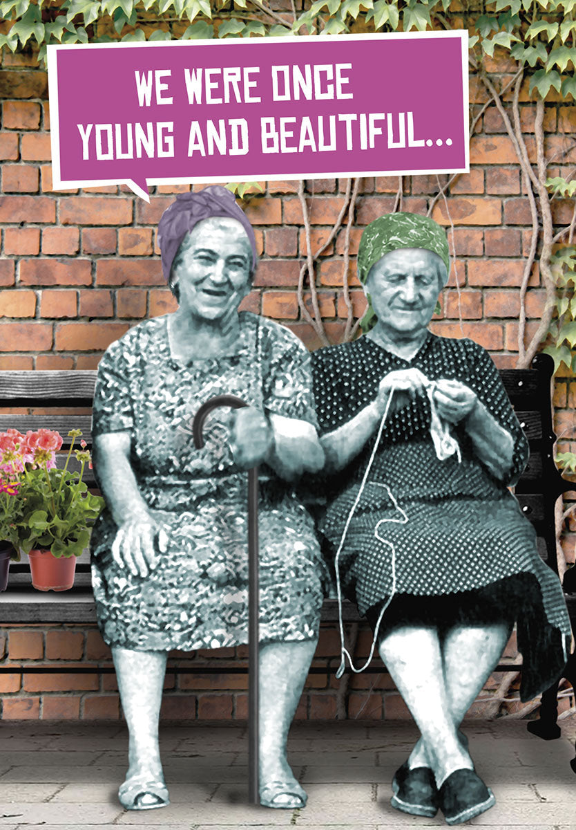 Greeting card featuring two cheerful elderly women on a bench, one knitting, under text 'WE WERE ONCE YOUNG AND BEAUTIFUL...'. Perfect for a humorous celebration of age and beauty.