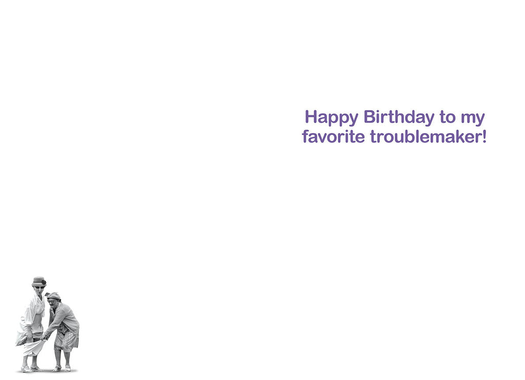 Inside of a humorous birthday card with purple text 'Happy Birthday to my favorite troublemaker!' and a small image of two old women at the bottom.