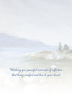 Inside of a thoughtful greeting card featuring a soft watercolor lake scene and message 'Wishing you peaceful moments of reflection that bring comfort and love to your heart.'