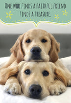 Two adorable golden retriever puppies stacked on top of each other, one resting its head on the other's back, both looking forward. Above them, a green speech bubble reads 'ONE WHO FINDS A FAITHFUL FRIEND FINDS A TREASURE.' with yellow flower illustrations. The image promotes friendship and loyalty, perfect for a heartwarming greeting card.