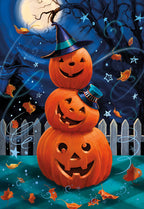 Three smiling jack-o'-lanterns stacked like a snowman, wearing a witch hat and a mini top hat, under a full moon with swirling stars and falling autumn leaves, a white picket fence in the background. Front of a funny Halloween greeting card.