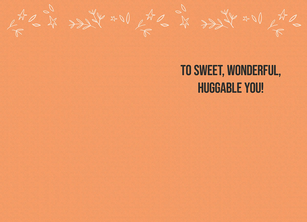 Inside of a friendly greeting card featuring a simple orange background with white leaf accents and the message 'TO SWEET, WONDERFUL, HUGGABLE YOU!' in bold black text.