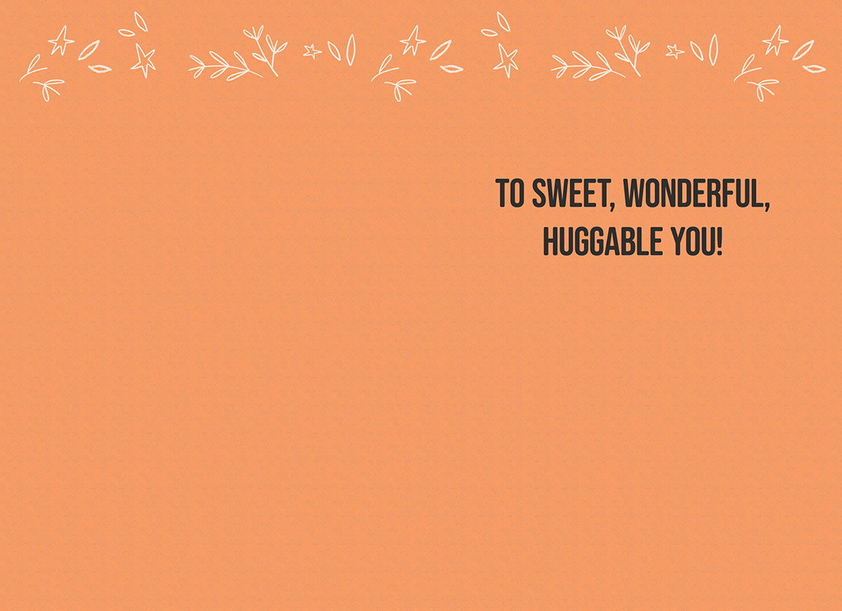 Inside of a friendly greeting card featuring a simple orange background with white leaf accents and the message 'TO SWEET, WONDERFUL, HUGGABLE YOU!' in bold black text.