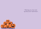Inside of a light purple Halloween card displaying the message 'Wishing you the most spooktacular Halloween!' with a pile of cute, grinning jack-o'-lanterns at the bottom.