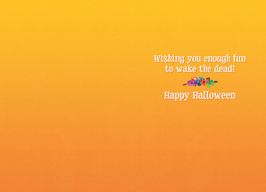 Inside of a humorous greeting card featuring an orange background with the text 'Wishing you enough fun to wake the dead! Happy Halloween' and small floral illustration.