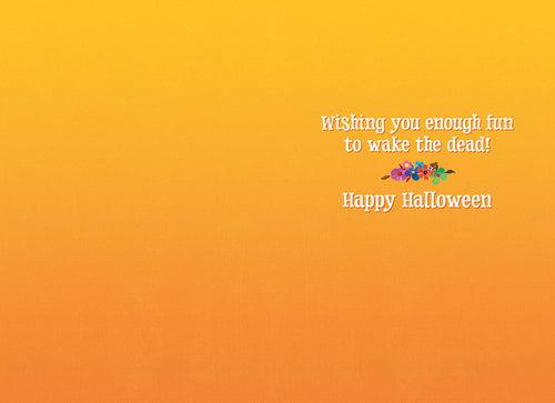 Inside of a Halloween greeting card with a bright orange background and the playful message 'Wishing you enough fun to wake the dead! Happy Halloween' in a whimsical font.