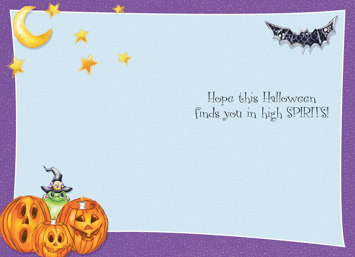 Inside of a cute Halloween greeting card featuring the message 'Hope this Halloween finds you in high SPIRITS!' in playful font, with jack-o'-lanterns, a witch hat-wearing frog, moon, stars, and bat illustrations on a light blue background.